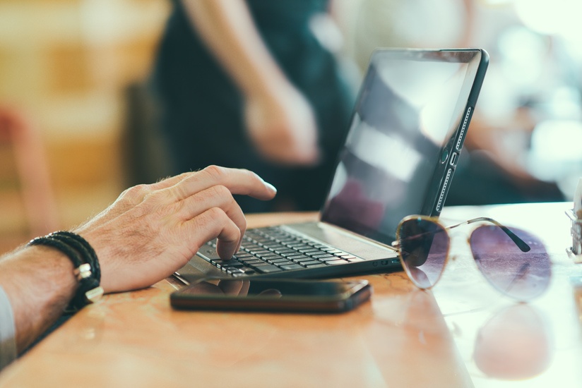 sunglasses-hand-smartphone-desk-large